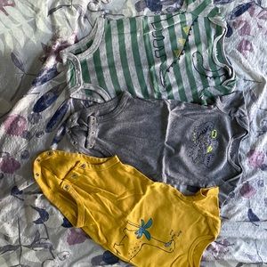 Baby dinosaur onesie lot.